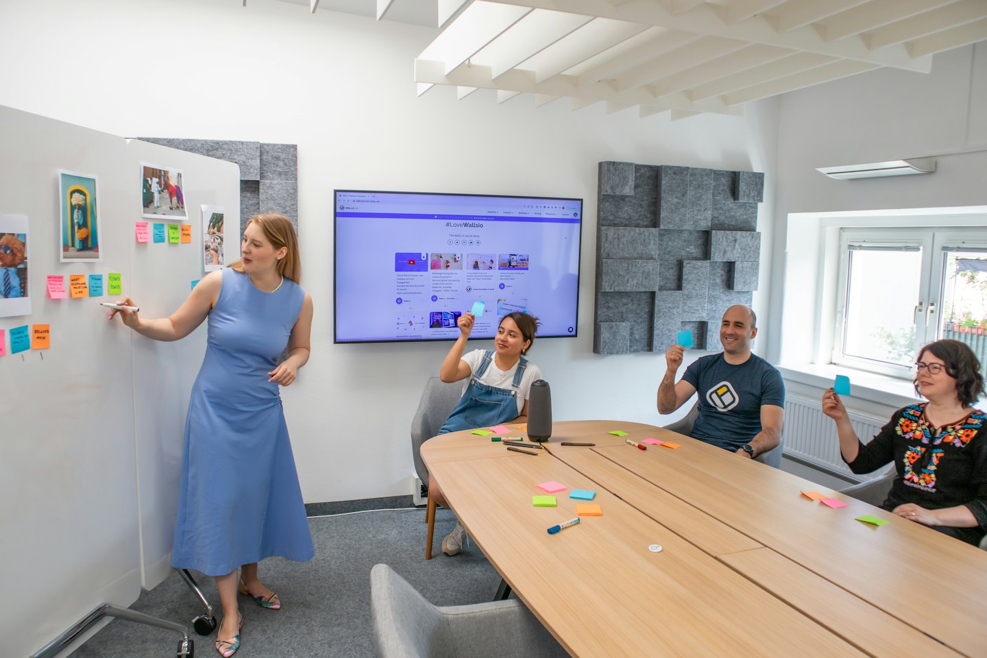 Diverse professionals brainstorming ideas in a modern meeting room.